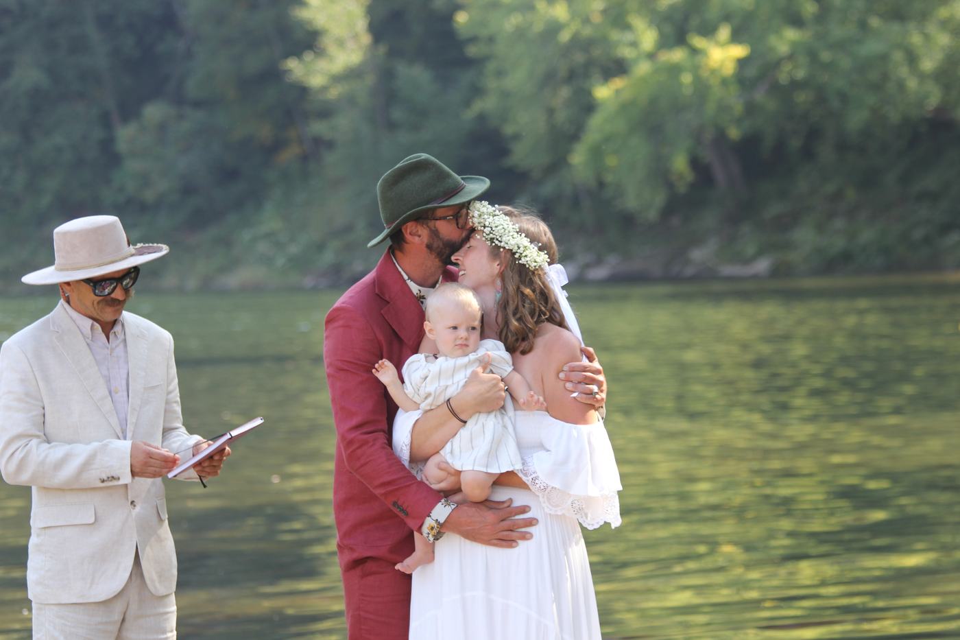 Family moment during a riverside ceremony